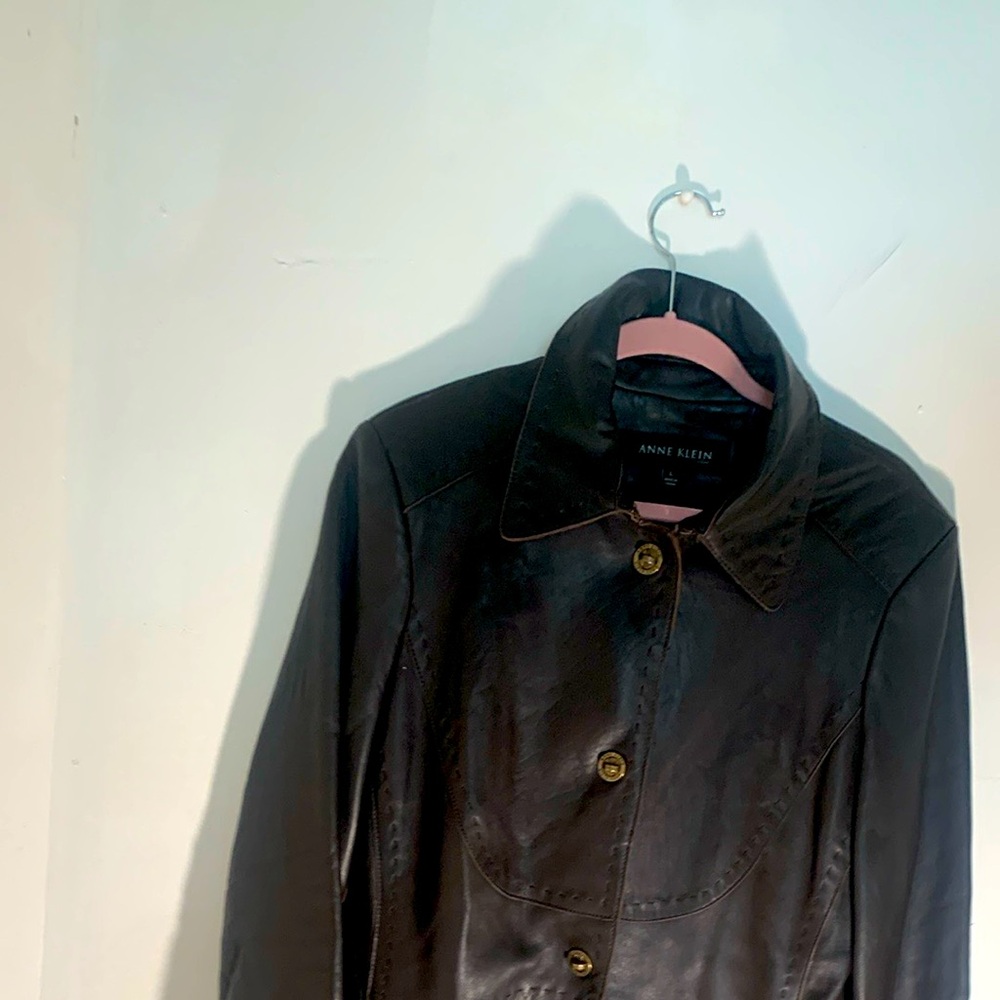 Woman Leather jacket, size large, color brown.not new but wear 2 or 3 times.